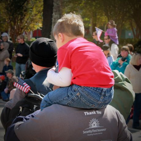 Photo of child and father at a Security First community event in Florida